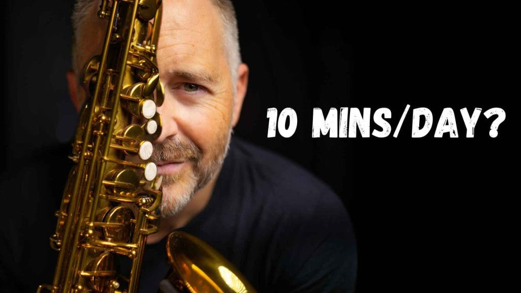 Jay Metcalf holding BetterSax alto saxophone